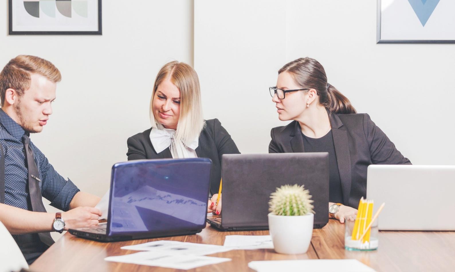 Financial analyst reviewing budget performance charts and metrics on computer screen
